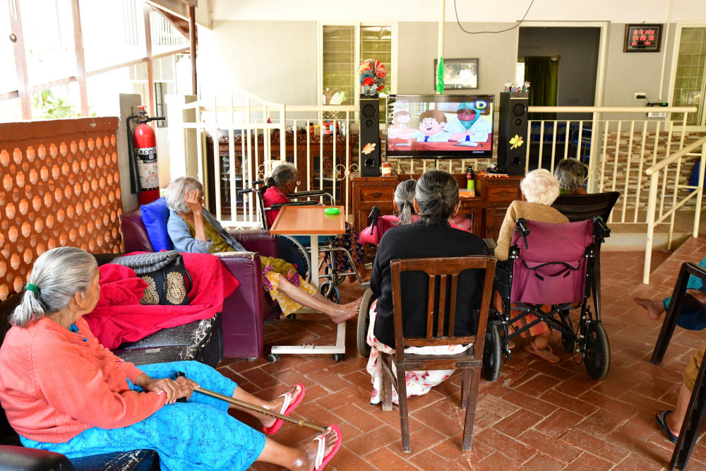 Residents watch TV together at the NMT - Tanya Mathias Elder Care CEntre