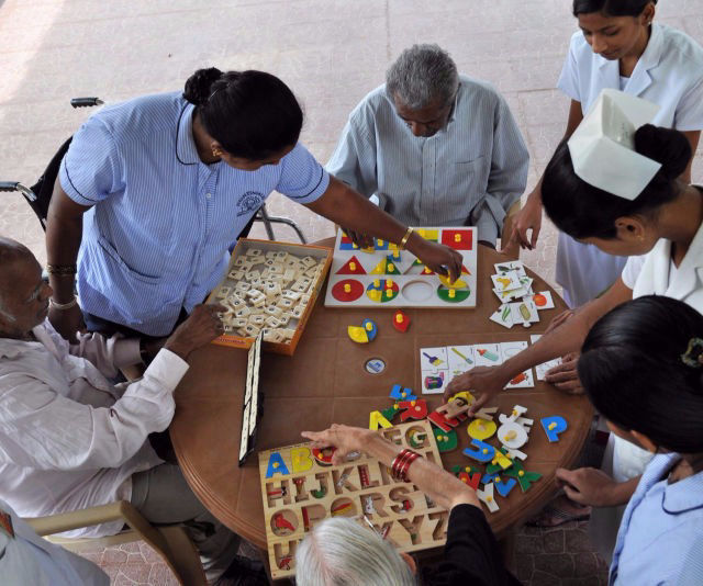 A group of residents enjoy cognitive games at one of NMT's Residential Care Centres